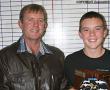 Rookie van die Jaar Clinton van der Walt (13) ontvang sy trofee by die Soutpansberg Gholfklub se jaareindfunksie van klubkaptein Pieter Senekal (links).