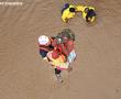 A police diver in the process of hoisting personnel trapped by flood waters at Shingwedzi in Kruger National Park, to safety into an Oryx helicopter.  The picture was taken on Monday at the personnel quarters near the camp. Photo supplied: WO2 Noel Kloppers / AFB Hoedspruit.