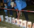 Carel VIljoen van die Cowell, Vise & Naude se span steek 'n kers aan tydens die KANSA Relay for Life se luminaria-seremonie waar die mense wat weens kanker oorlede is onthou word.  Foto: Cindy van der Merwe.

