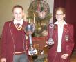 <p>Coreen Meiring (links) van Ho&euml;rskool Louis Trichardt ontvang die trofee vir die skool se top kultuurleerling. Saam met Coreen is Liesbet Voigt, wat die Finesse-trofee ontvang.</p>
