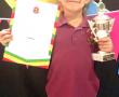 <p>Die jong Mijanke Venter het tydens Laerskool Levubu se prysuitdeling die skool se Hokkie Bokkie van die Jaar-trofee ontvang. Foto verskaf.</p>
