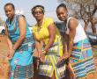 <p>Gladys Mabila, Thinavhuyo Nephawe and Tinstwalo Nthabalala (Mutanuni) show how Venda women show respect during a heritage celebration at Nzhelele.</p>
